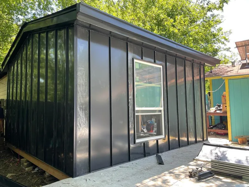 Black standing seam metal wall panels for Roof Inspection in Destrehan